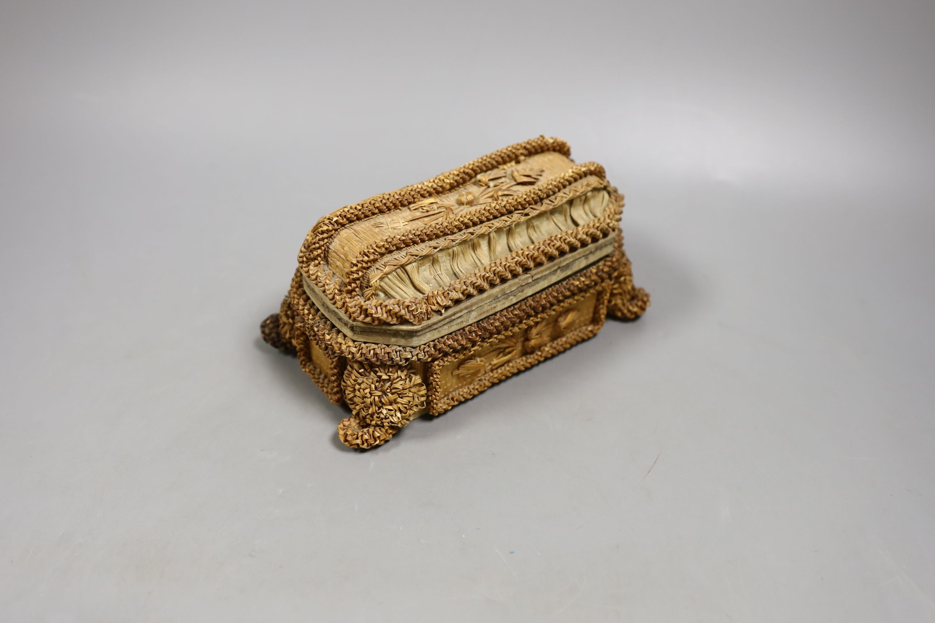 A small 19th century straw work casket., 17cms wide x 9cms high.